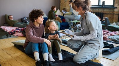 Clinician gathering information from mother and daughter