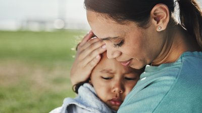 Mother comforting young child